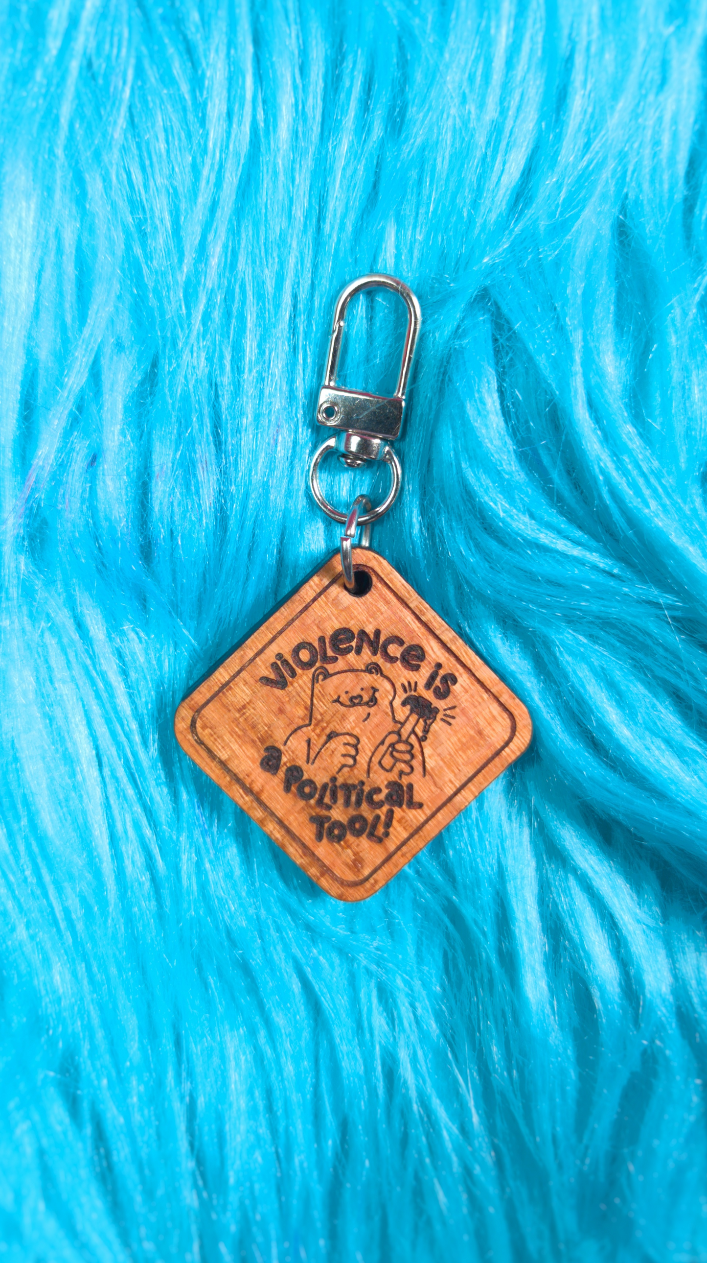 Violence is a political tool keychain/magnet!
