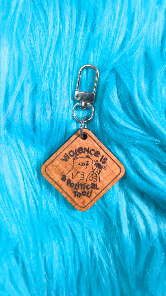 Violence is a political tool keychain/magnet!