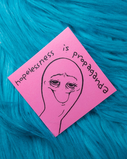 "hopelessness is propaganda" sticker!